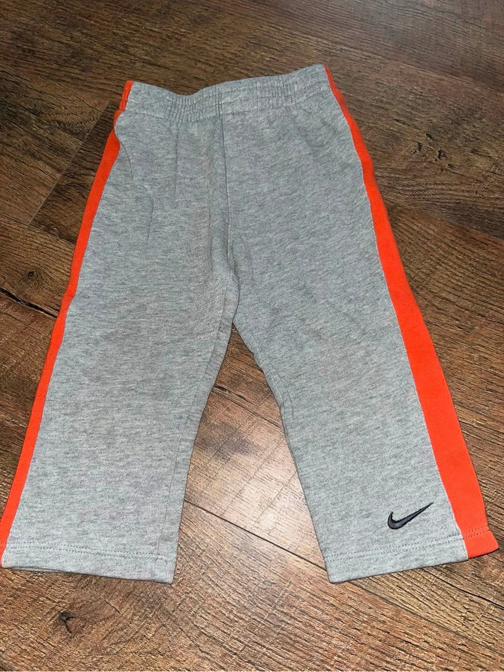 Nike Grey Sweatpants with Orange Side Stripes for Kids